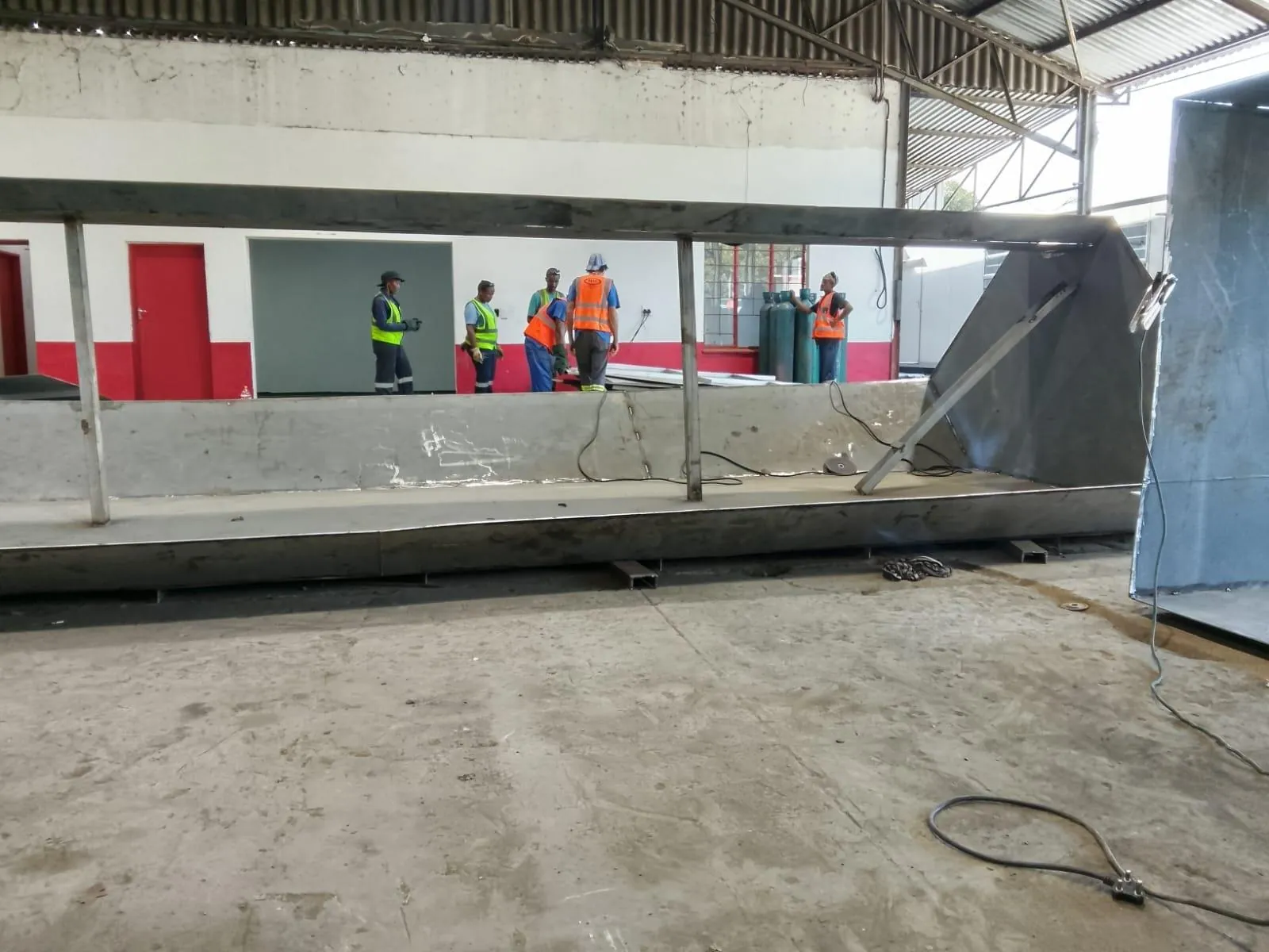 SAF team fabricating boiler parts in a mill workshop