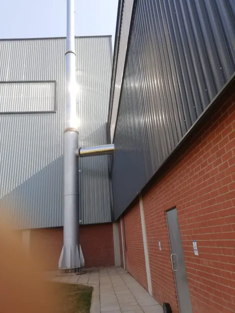 Stainless external stack on the factory wall