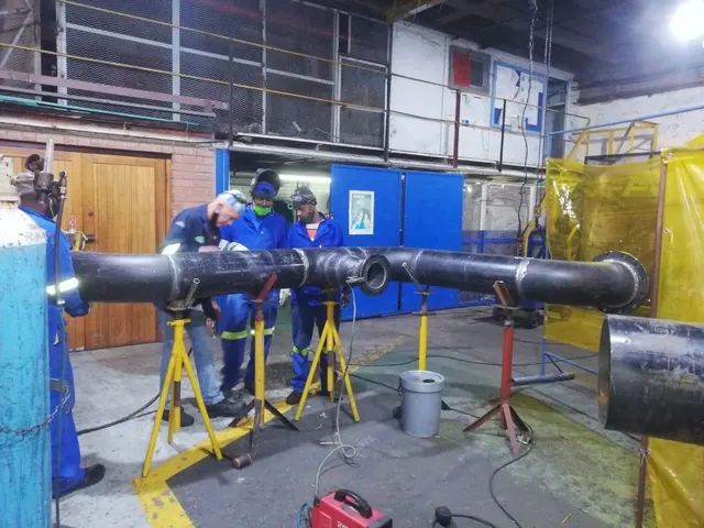 Pipe spool being welded in the workshop
